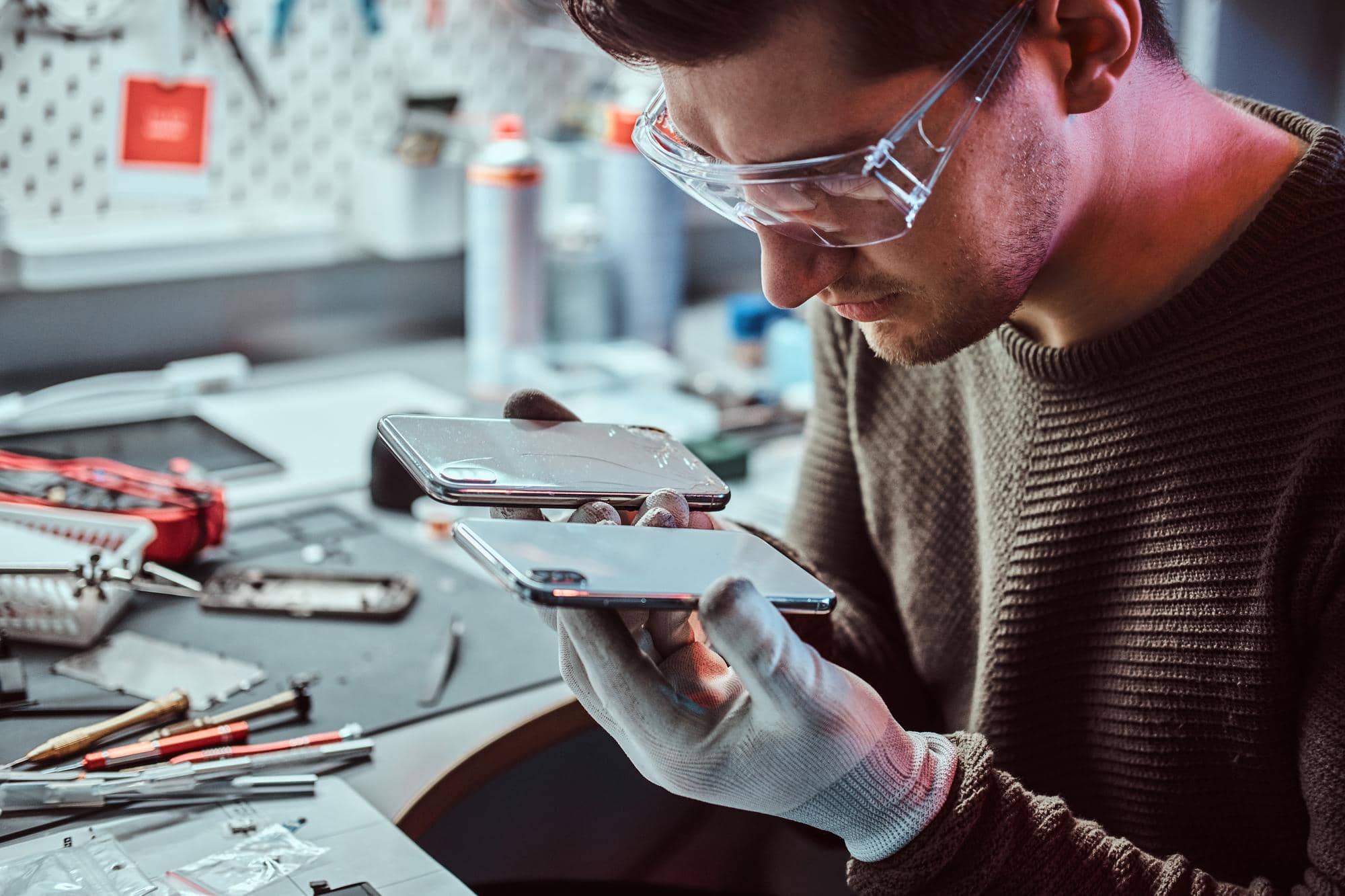 man fixing a phone